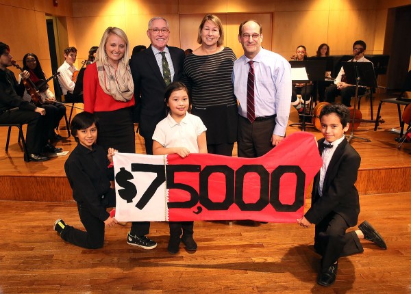 Front L-R:  W.O. Smith students Jean Carlo Arias Neda, age 10; Whitney Thai, age 8; and Gabriel Barreda, age 11.  Back L-R: Tiffany Kerns, CMA Community Outreach Manager; Ron Samuels, CMA Foundation Board Chairman; Sarah Trahern, CMA Chief Executive Officer; Jonah Rabinowitz, W.O. Smith School Executive Director. (Photo: Kayla Schoen / CMA)